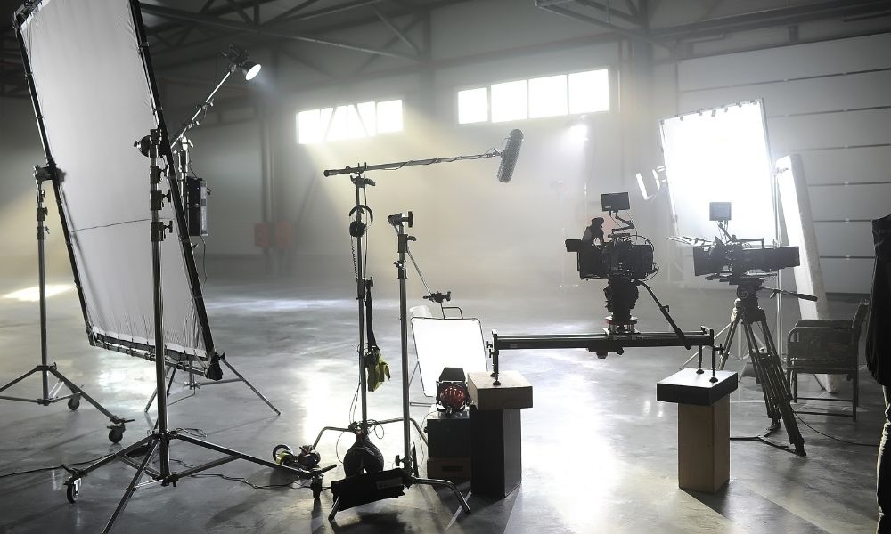 A working film studio with lighting and camera equipment